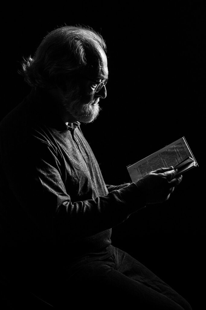 intelligence elderly man reading book