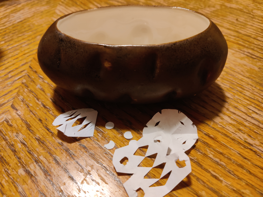 ceramic potato planter with paper snowflakes; connection