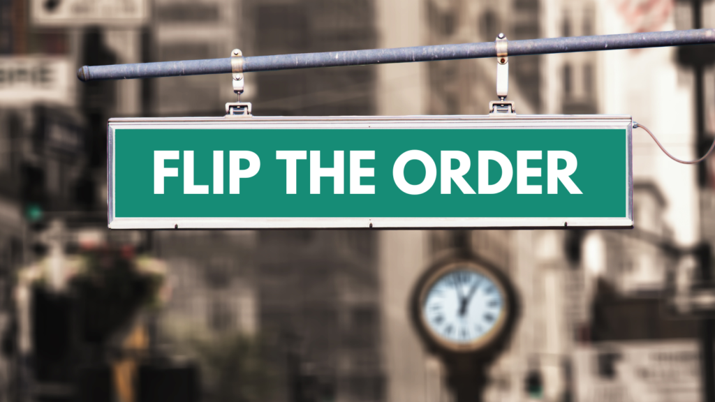 street sign that reads "flip the order"